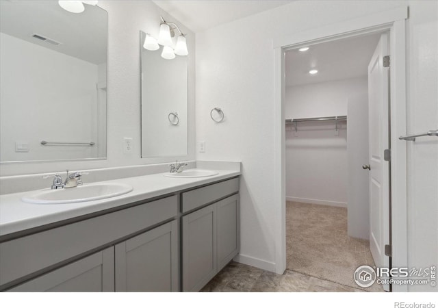 bathroom with tile patterned flooring and vanity