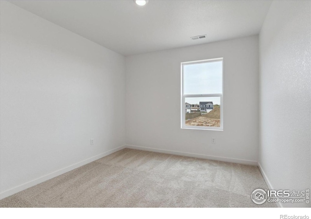 view of carpeted spare room