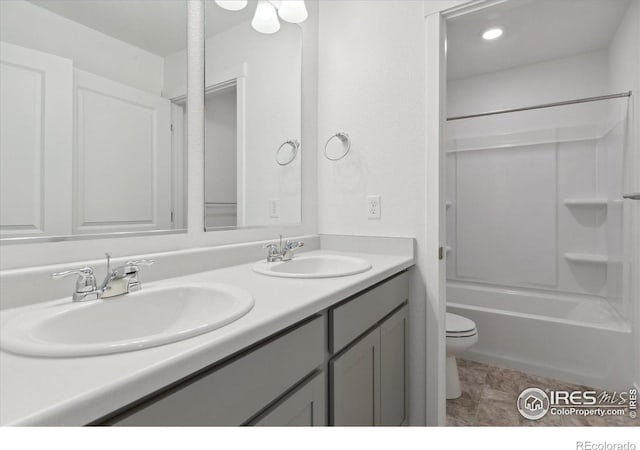 full bathroom with vanity, shower / bathing tub combination, and toilet