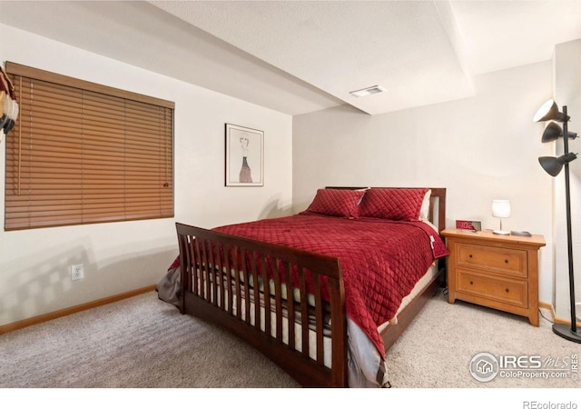 bedroom featuring light carpet