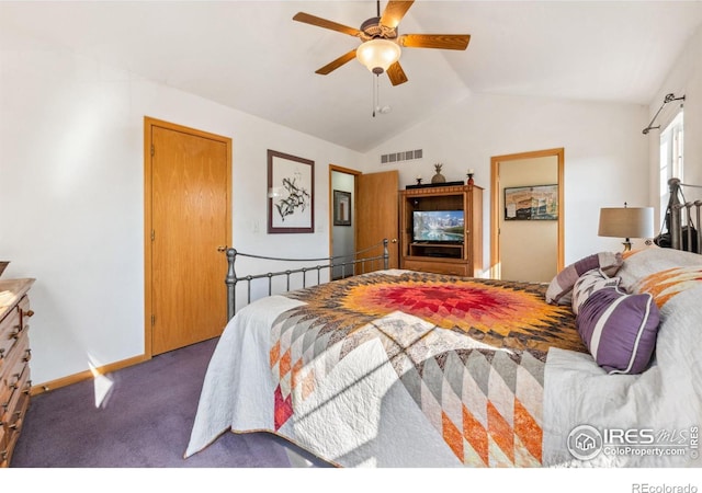 carpeted bedroom with ceiling fan and lofted ceiling