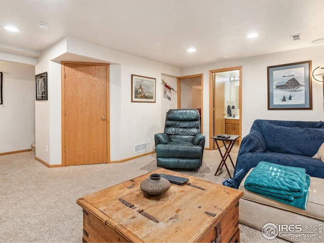 living room featuring light carpet