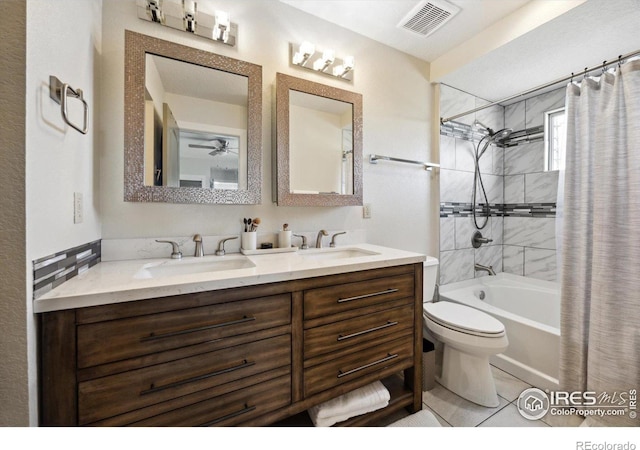 full bathroom with vanity, toilet, tile patterned floors, and shower / bath combo