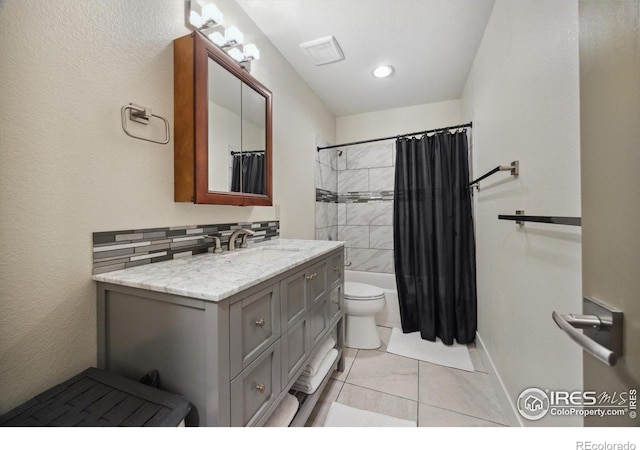 full bathroom with toilet, tile patterned floors, vanity, backsplash, and shower / tub combo with curtain