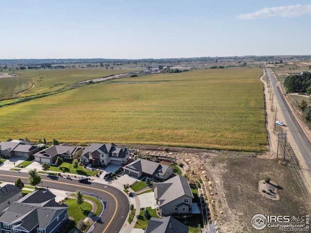 birds eye view of property with a rural view