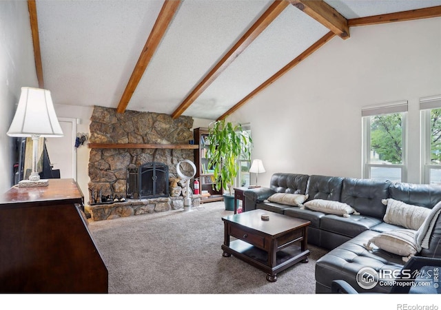 carpeted living room with a fireplace, a textured ceiling, and lofted ceiling with beams