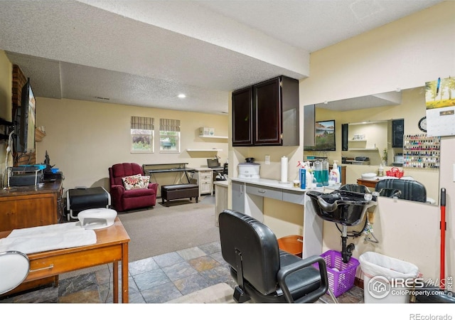 carpeted living room featuring a textured ceiling