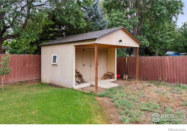 view of outbuilding with a yard