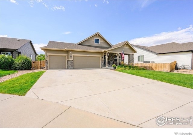 view of front of house with a garage and a front lawn