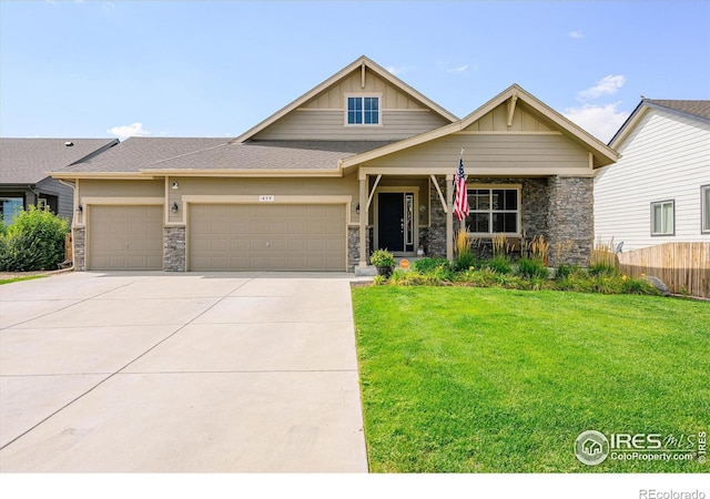 craftsman house with a garage and a front yard