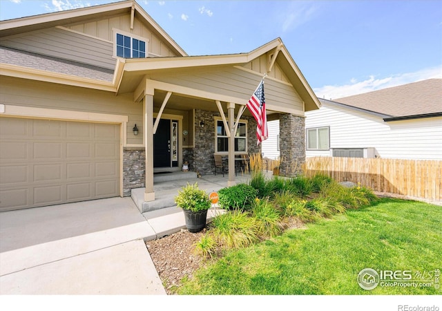 view of front of home with a garage and a front lawn