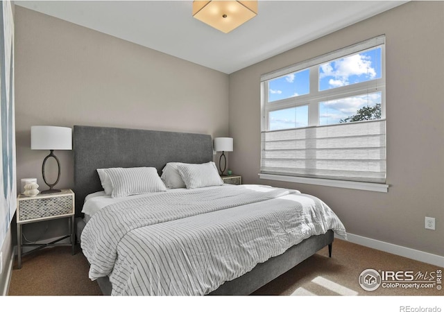 carpeted bedroom with vaulted ceiling