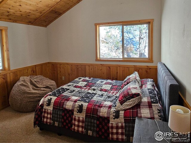 bedroom with carpet, lofted ceiling, and wooden ceiling