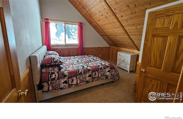 bedroom featuring lofted ceiling with beams, wooden walls, carpet, and wooden ceiling