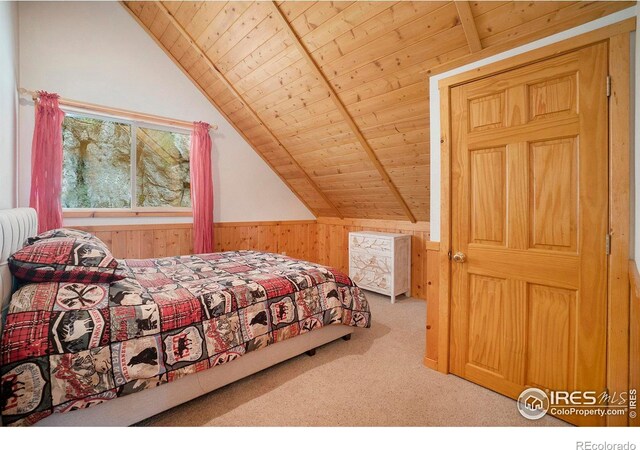 carpeted bedroom featuring lofted ceiling with beams, wooden ceiling, and wood walls