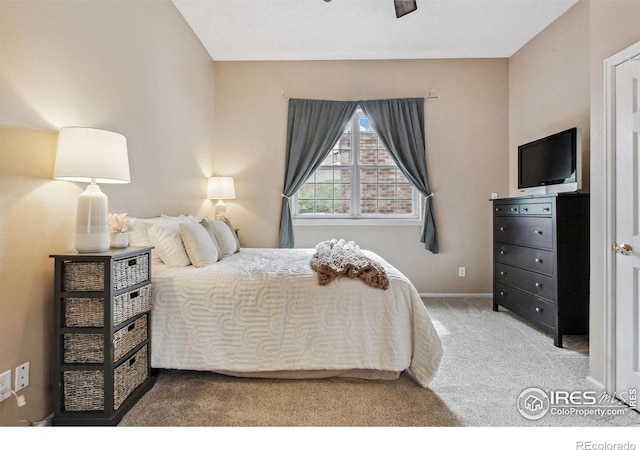 bedroom featuring ceiling fan and carpet floors