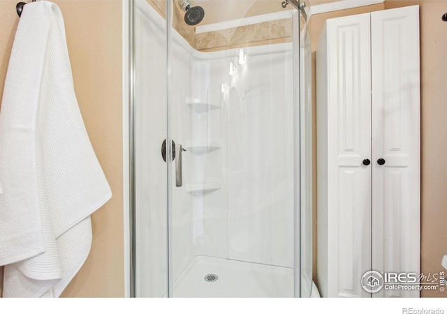 bathroom featuring an enclosed shower