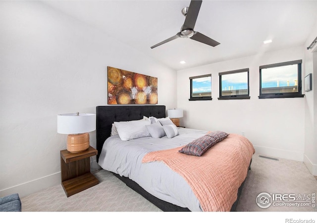 carpeted bedroom featuring ceiling fan