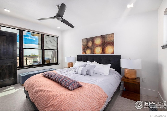 carpeted bedroom with ceiling fan