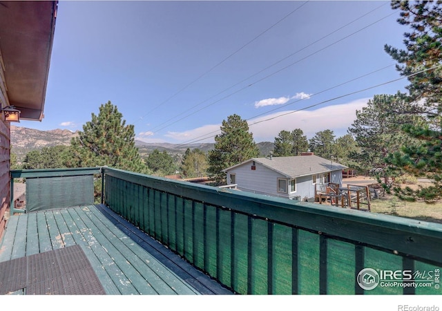 wooden terrace featuring a mountain view