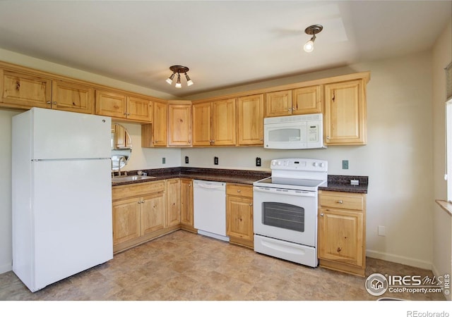 kitchen featuring white appliances and sink