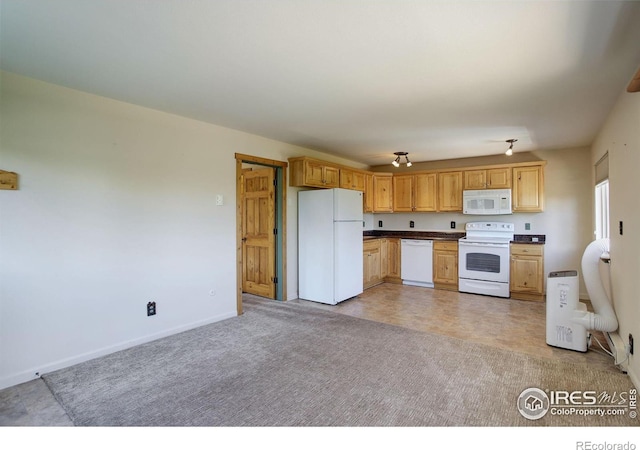 kitchen with white appliances and light carpet