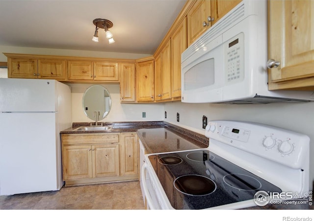 kitchen featuring white appliances and sink