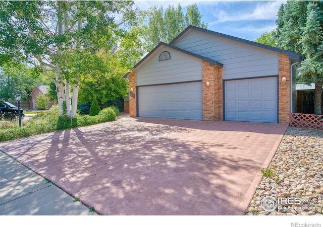 exterior space with an outbuilding and a garage