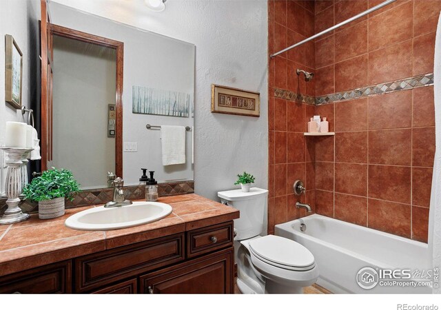 full bathroom featuring vanity, toilet, and shower / bathtub combination with curtain