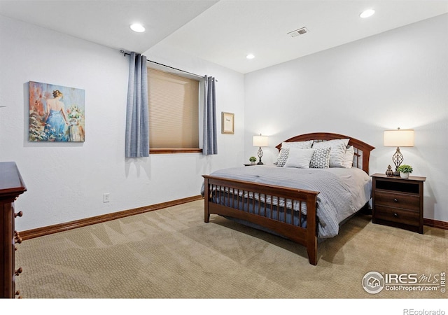 bedroom featuring light carpet