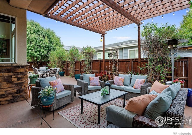 view of patio with an outdoor living space and a pergola