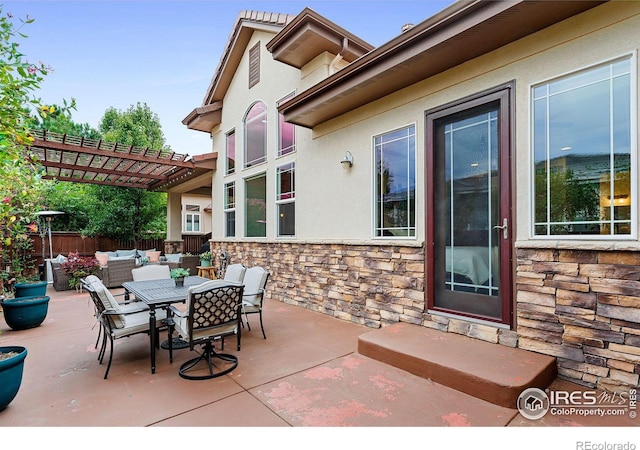 view of patio with a pergola and outdoor lounge area