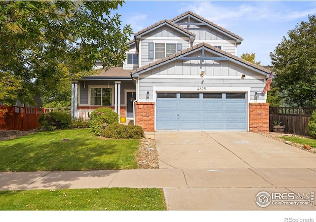 craftsman-style house with a garage, a front yard, and a porch