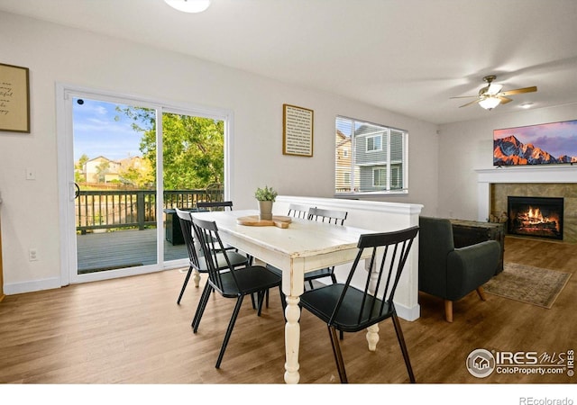 dining area featuring plenty of natural light, ceiling fan, and light hardwood / wood-style flooring