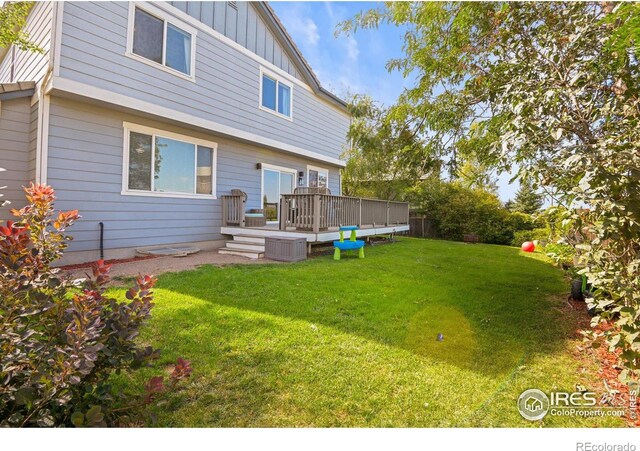 view of yard featuring a wooden deck