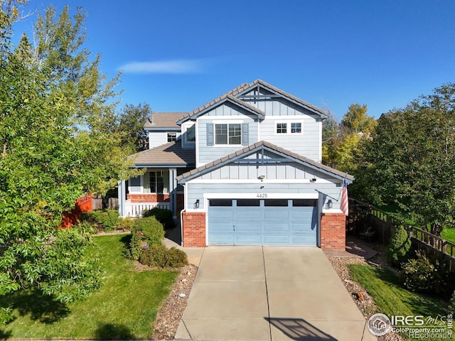 craftsman-style home featuring a garage and a front yard