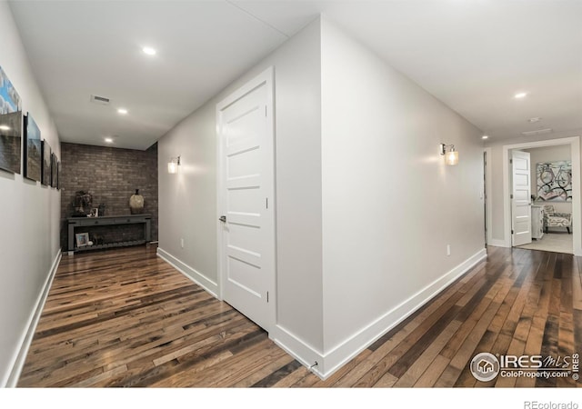 hallway with dark wood-type flooring