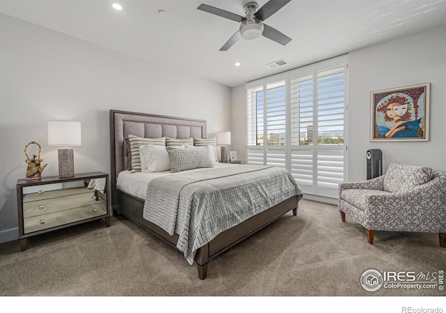 bedroom with ceiling fan and carpet