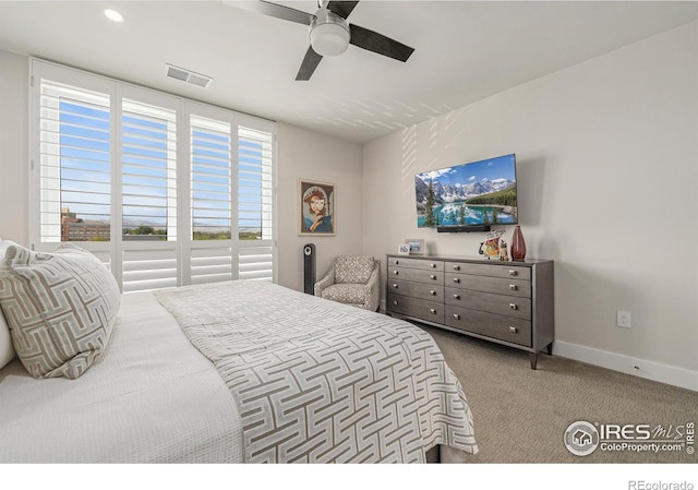 bedroom featuring light carpet and ceiling fan