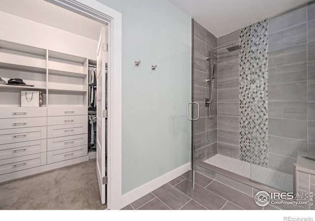 bathroom with a shower with door