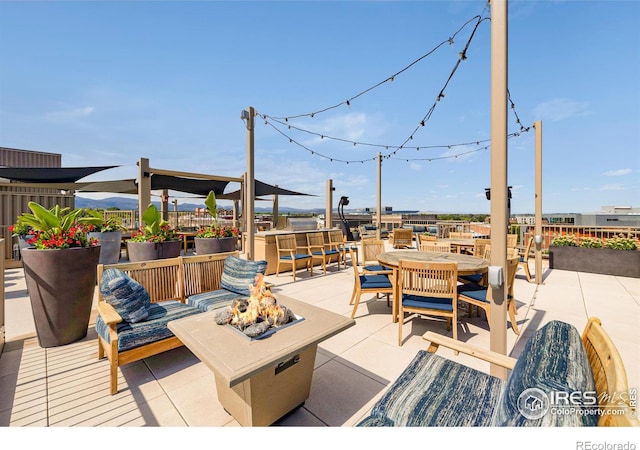 wooden terrace featuring an outdoor hangout area and a patio area