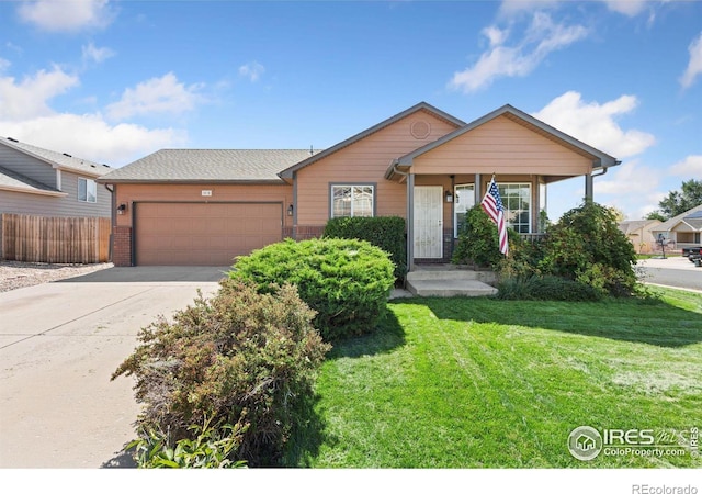 view of front facade featuring a front lawn and a garage