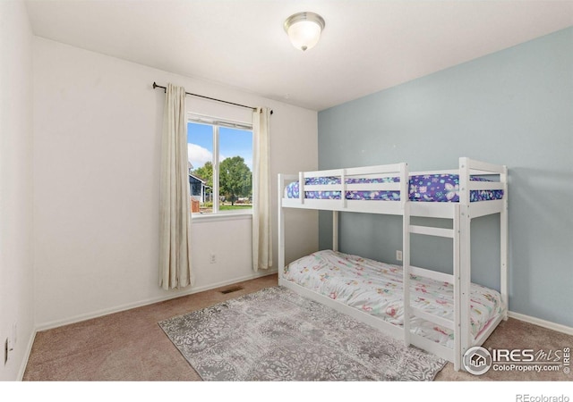 bedroom featuring carpet flooring