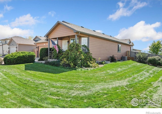 view of home's exterior featuring cooling unit and a yard