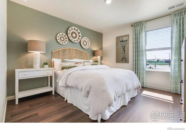 bedroom featuring dark wood-type flooring