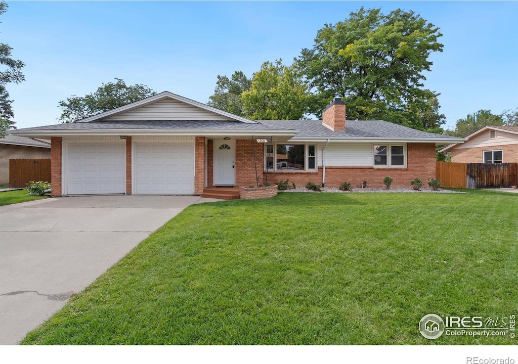 ranch-style house with a front yard and a garage