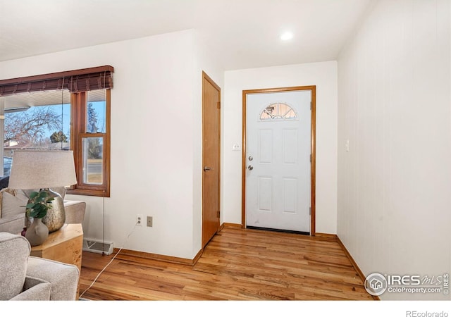 entryway with light hardwood / wood-style flooring