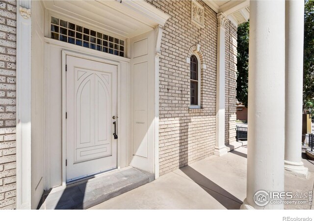 property entrance featuring covered porch