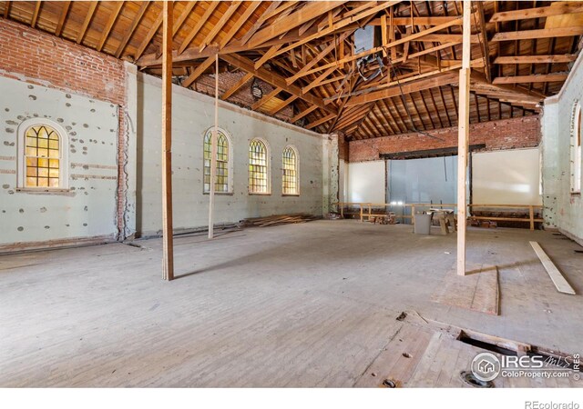 miscellaneous room featuring high vaulted ceiling