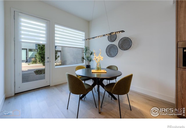 dining area with light wood-type flooring